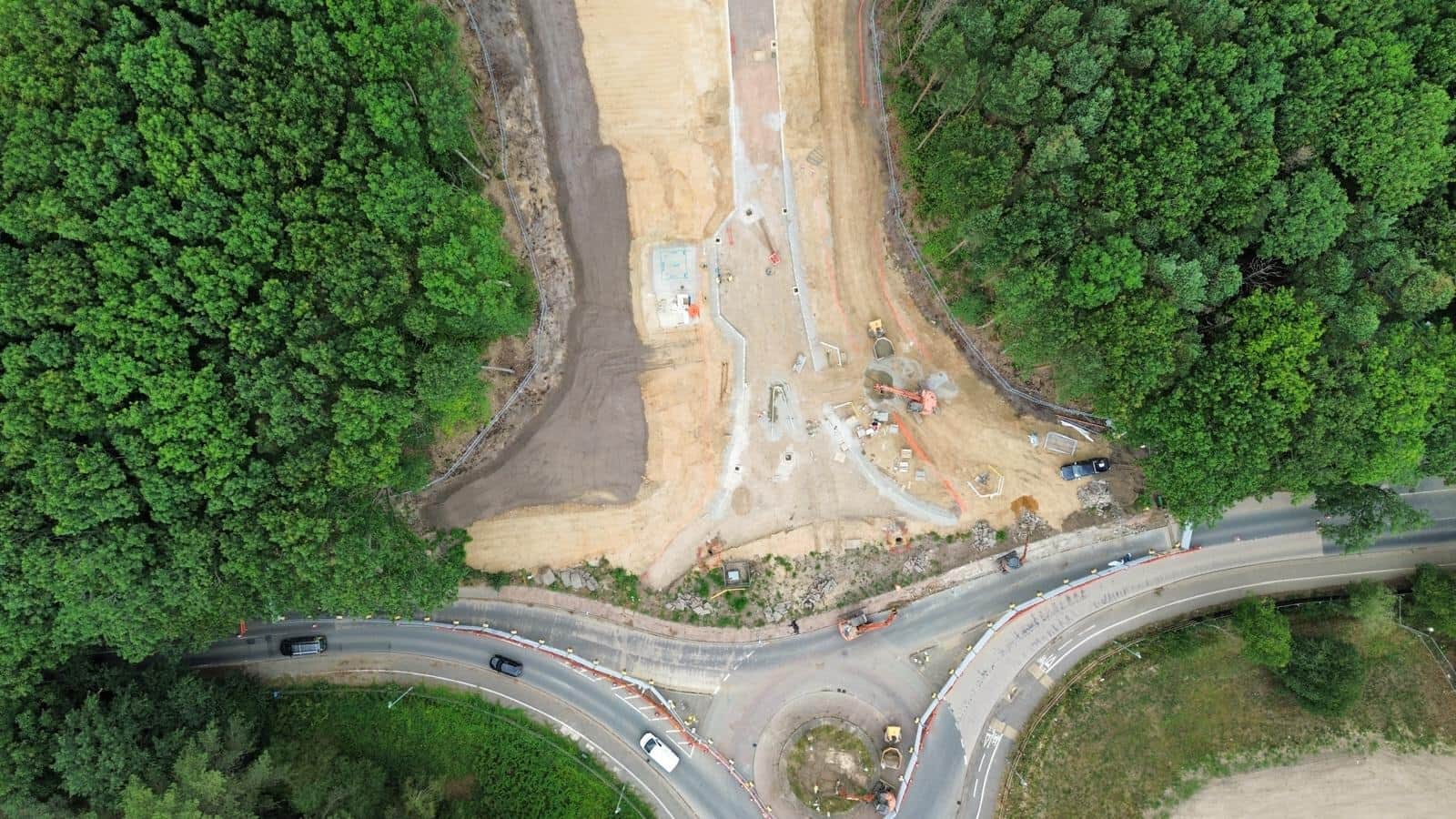 Aerial view of a roundabout and access road under construction